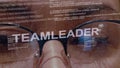 Teamleader text on female software developer