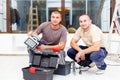 Teammate Electricians With Tool Boxes