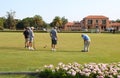 Teams of active senior citizens engaged in a game of lawn bowling at the Rotorua Bowling Club