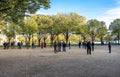 Teams of players participate in classic French petanque boule game in Les Invalides park, Paris