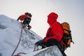 Teamwork in alpinism. Mountaineering. Traverse of mountain.
