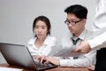 Teamwork and brainstorm concept. Group of Asian business people working with laptop together in modern office Royalty Free Stock Photo