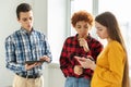 Teamwork brainstorm young professional team concept. Happy multiracial coworkers cooperating working together at office Royalty Free Stock Photo