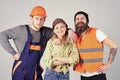 Teamwork, brigade. Company of cheerful workers, builder, repairer, plasterer. Group of man and woman with smiling faces