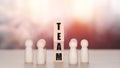 Teamwork and business concept. Wooden blocks stack with the text of the team and wooden figure. Success in work, new ideas, and Royalty Free Stock Photo