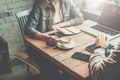 Teamwork. Businessman and businesswoman sitting at table in coffee shop and discuss business plan. Royalty Free Stock Photo