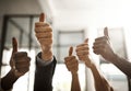 Teamwork, collaboration and thumbs up sign from diverse businesspeople approving and endorsing positive message. Closeup