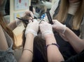 Teamwork. Collective work on cutting and coloring hair in the beauty salon. Royalty Free Stock Photo