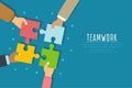 Teamwork concept. Businessmen hold in hands and connect the pieces of jigsaw puzzle. Team work business metaphor.