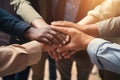 Teamwork concept. Close up of young multiethnic businesspeople holding hands together, Group of diverse hands holding each other Royalty Free Stock Photo