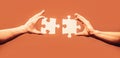 Teamwork concept. Closeup hand of connecting jigsaw puzzle. Holding puzzle. Business solutions, success and strategy Royalty Free Stock Photo