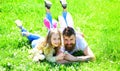 Teamwork concept. Dad and girl found easter eggs in traditional hunting game in. Man with beard and cute child lay on Royalty Free Stock Photo