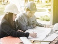 Teamwork concept, Engineer and workers discussing project of new building. ,Team of architects Asian people in group on Royalty Free Stock Photo