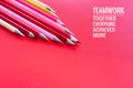 Teamwork concept. group of color pencil on pink background with word Teamwork, Together, Everyone, Achieves and More