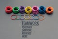 Teamwork concept. group of colorful rubber band on black background with word Teamwork, Together, Everyone, Achieves and More Royalty Free Stock Photo