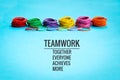 Teamwork concept. group of colorful rubber band on blue background with word Teamwork, Together, Everyone, Achieves and More Royalty Free Stock Photo