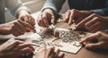 Teamwork Concept with Hands Assembling Puzzle Pieces Together Royalty Free Stock Photo