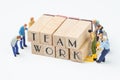 Teamwork concept idea, miniature people figurine work as team he Royalty Free Stock Photo