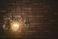 Teamwork concept Vintage bulbs on brick wall background, copy space for text,3d rendering