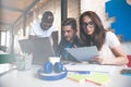 Teamwork concept.Young creative coworkers working with new startup project in modern office.Group of three people Royalty Free Stock Photo