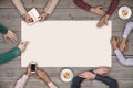 Teamwork and cooperation concept - top view of six people drawing or writing on a large white blank sheet of paper.