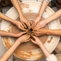 Teamwork and Creativity at the Potters Wheel Royalty Free Stock Photo