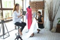 Teamwork designer concept : Fashion designer working near mannequin in office