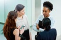 Teamwork divides the task and multiplies the success. businesswoman standing together while discussing business in the Royalty Free Stock Photo