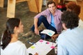 Teamwork divides the task and multiplies the success. a group of designers working together on a office floor.