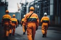 teamwork: group of industrial workers in a refinery - oil processing equipment and machinery. Neural network AI Royalty Free Stock Photo