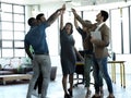 Teamwork, happy and celebration with business people in office and cheering for motivation, winner and solidarity Royalty Free Stock Photo