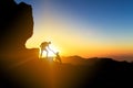 Teamwork helping hand couple climbing at sunset Royalty Free Stock Photo