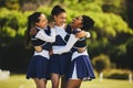 Teamwork, hug or happy cheerleader with women outdoor in training or sports event together. Celebrate, smile or proud Royalty Free Stock Photo