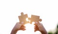 jigsaw puzzle, joining hands together, love, cooperation and unity in working together Royalty Free Stock Photo
