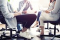 Teamwork is a key to success. Business people in smart casual wear talking and smiling while having a brainstorm meeting Royalty Free Stock Photo