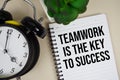 Teamwork is the Key to Success text written on notepad with alarm clock Royalty Free Stock Photo