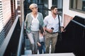 Teamwork leads us to success. a group of businesspeople walking up the stairs in a modern workplace. Royalty Free Stock Photo