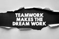 Teamwork makes the dream work inspirational text in bold distressed letters on torn paper background. Encouraging phrase Royalty Free Stock Photo