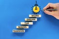 Teamwork makes dream work symbol. Concept words Teamwork makes the dream work on wooden blocks on a beautiful blue background. Royalty Free Stock Photo