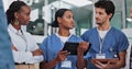 Teamwork, medical people and woman with tablet in meeting for research, planning and support for solution in hospital Royalty Free Stock Photo