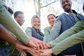 Teamwork, motivation and huddle with senior friends hiking together in the forest or woods from below. Fitness, exercise Royalty Free Stock Photo