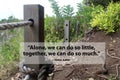 Teamwork motivational quote - Alone we can do so little, together we can do so much. With broken rope connection on wooden fence. Royalty Free Stock Photo