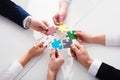 Teamwork of partners. Concept of integration and startup with puzzle pieces Royalty Free Stock Photo