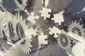 Teamwork of partners. Concept of integration and startup with puzzle pieces and gear overlay. double exposure Royalty Free Stock Photo