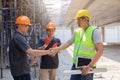 Teamwork, partnership, gesture concept. Builders greeting each other with handshake on construction site. construction workers in