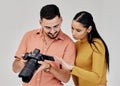 Teamwork, photographer and startup with camera in studio for shoot, magazine project or online content review. Digital Royalty Free Stock Photo