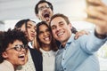 Teamwork, playful and selfie while a group of cheerful businesspeople making funny faces together for a social media Royalty Free Stock Photo