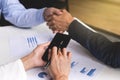 Teamwork process, Close-up of two business people shaking hands Royalty Free Stock Photo