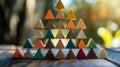 Teamwork Pyramid A pyramid structure built with geometric shapes, each representing a different race contributing to a common goal