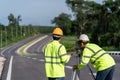 Teamwork of surveyor engineers with equipment on road construction site, Civil Engineers, Surveyor equipment Royalty Free Stock Photo
